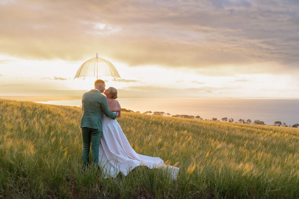Bride and groom silhouette against dramatic sky, Jack Rabbit Vineyard wedding
