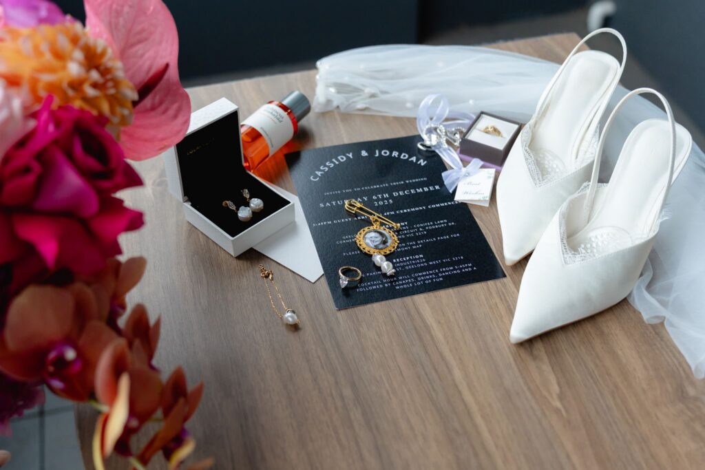 edding day flat lay with shoes and invitation before Botanic Gardens and Industry26 wedding