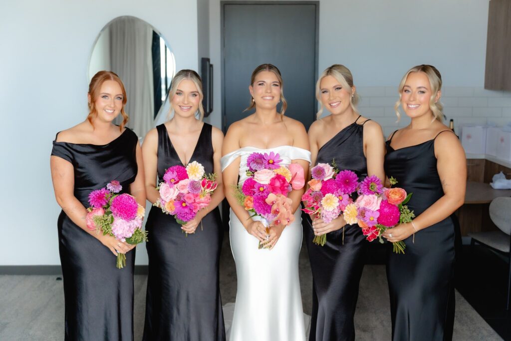 Bridesmaids formal group portrait with pink bouquets before Botanic Gardens and Industry26 wedding