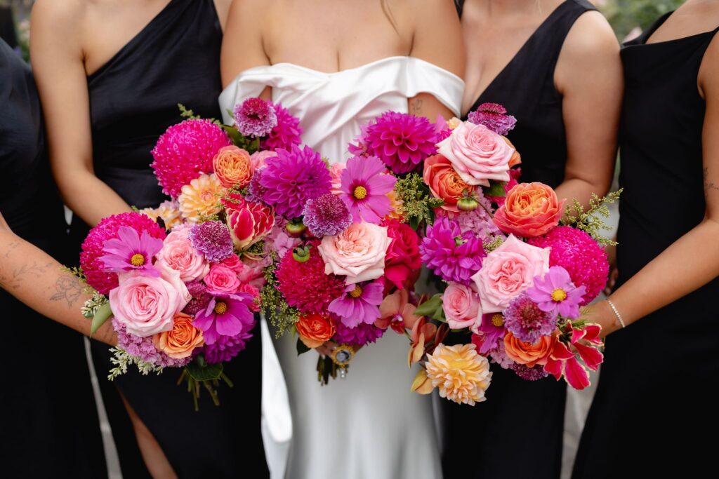 Bridal bouquet detail in bright pink and orange tones at Geelong Botanic Gardens wedding