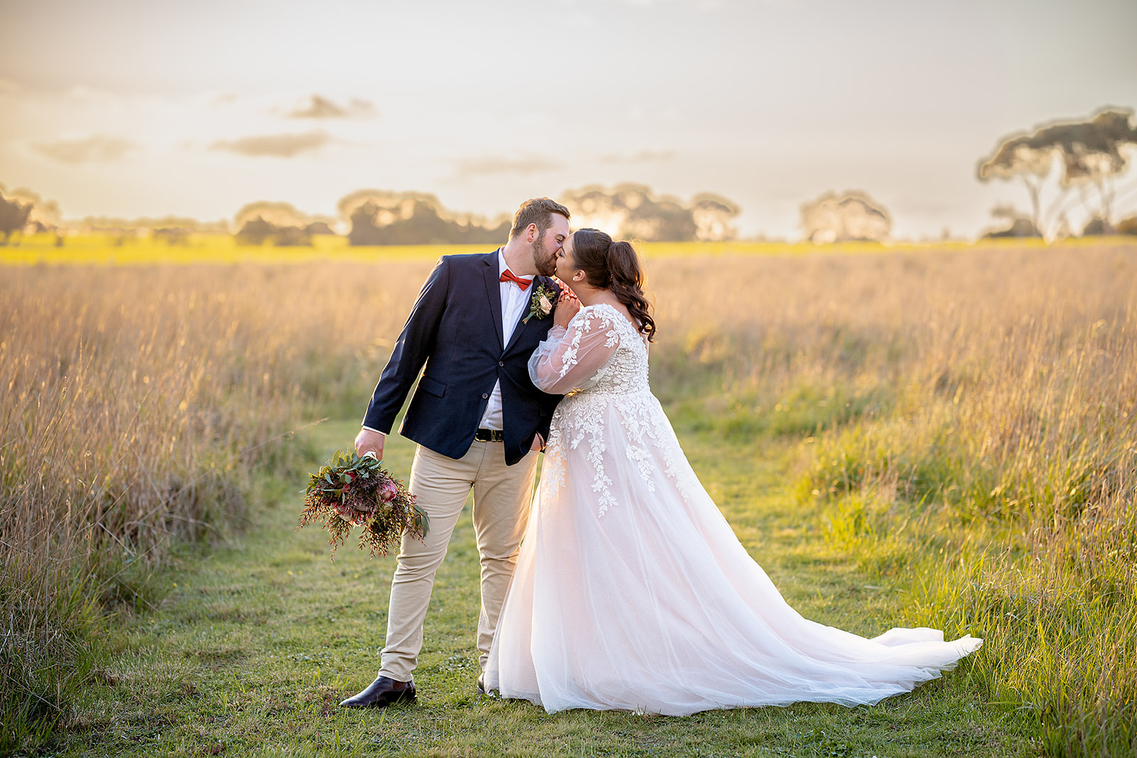 Brydie and James portrait in the golden fields at Rocklea Farm, Stonehaven