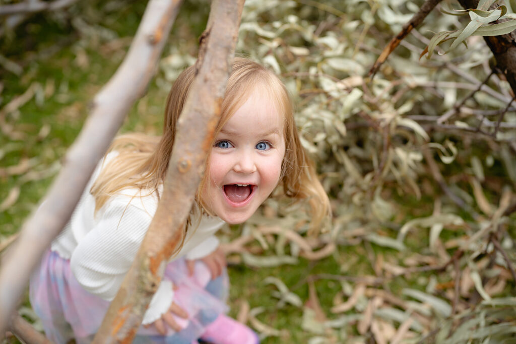 Ivy playing outdoors during a family photography session at Balyang Sanctuary