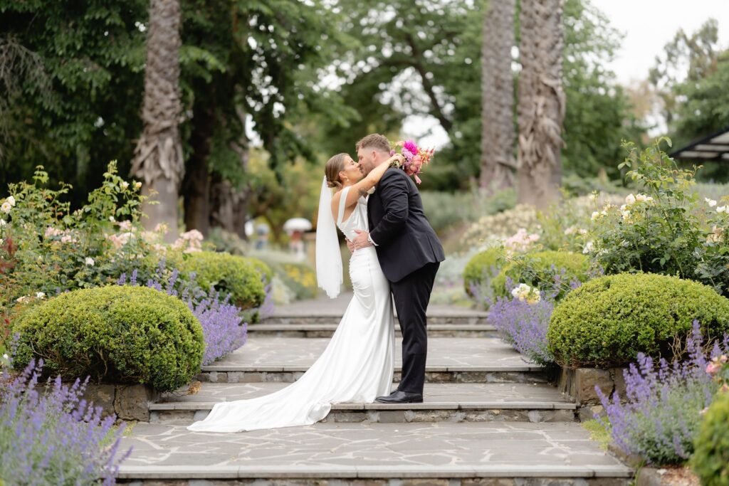 Bride and groom on the garden staircase at Geelong Botanic Gardens wedding
