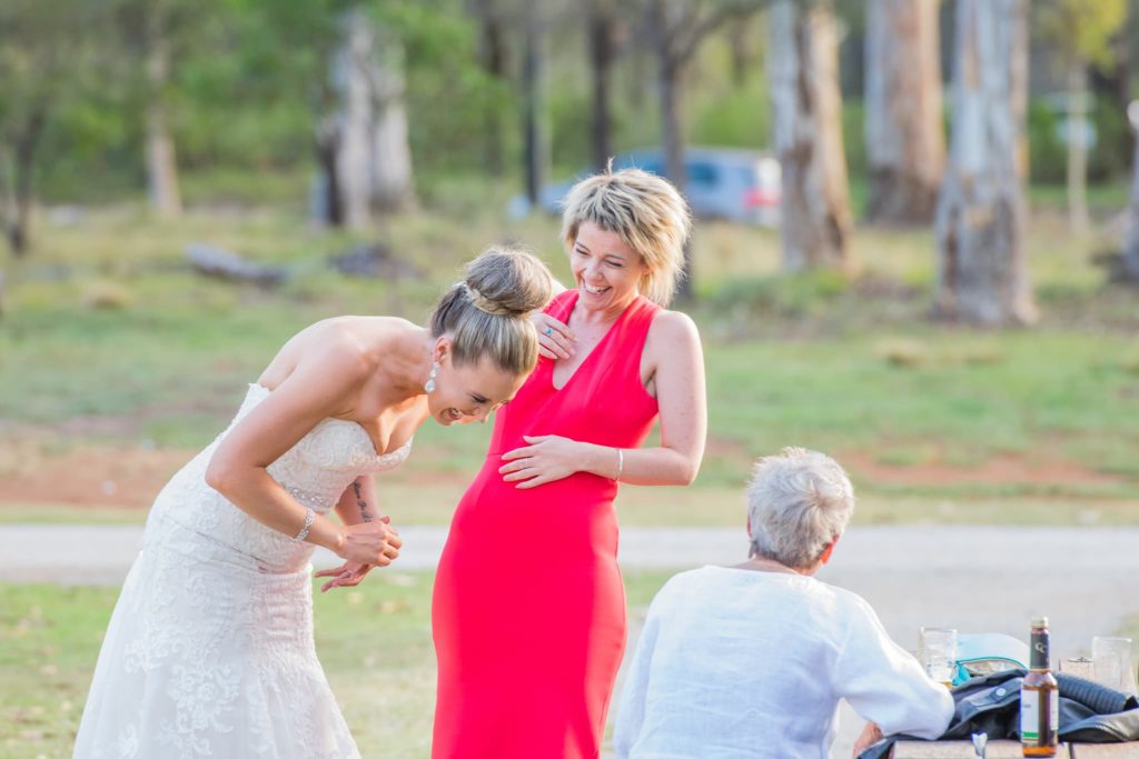 A Bride and a guest having a laugh together at her wedding at Eynesbury Homestead, VIC