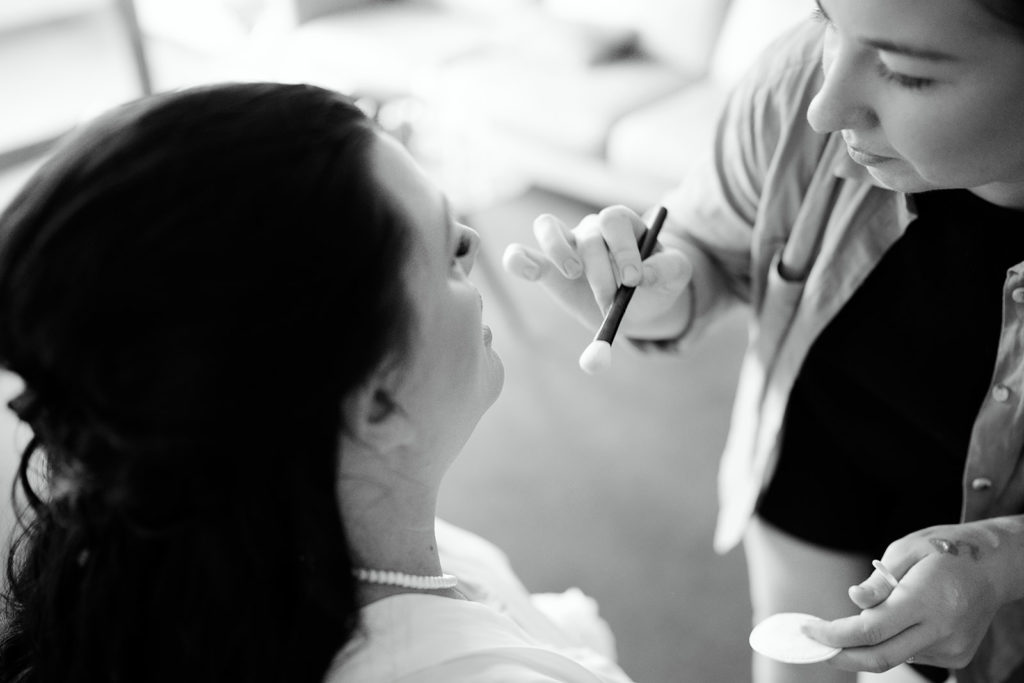 Bride having her makeup applied  before her wedding at the Batesford Hotel.