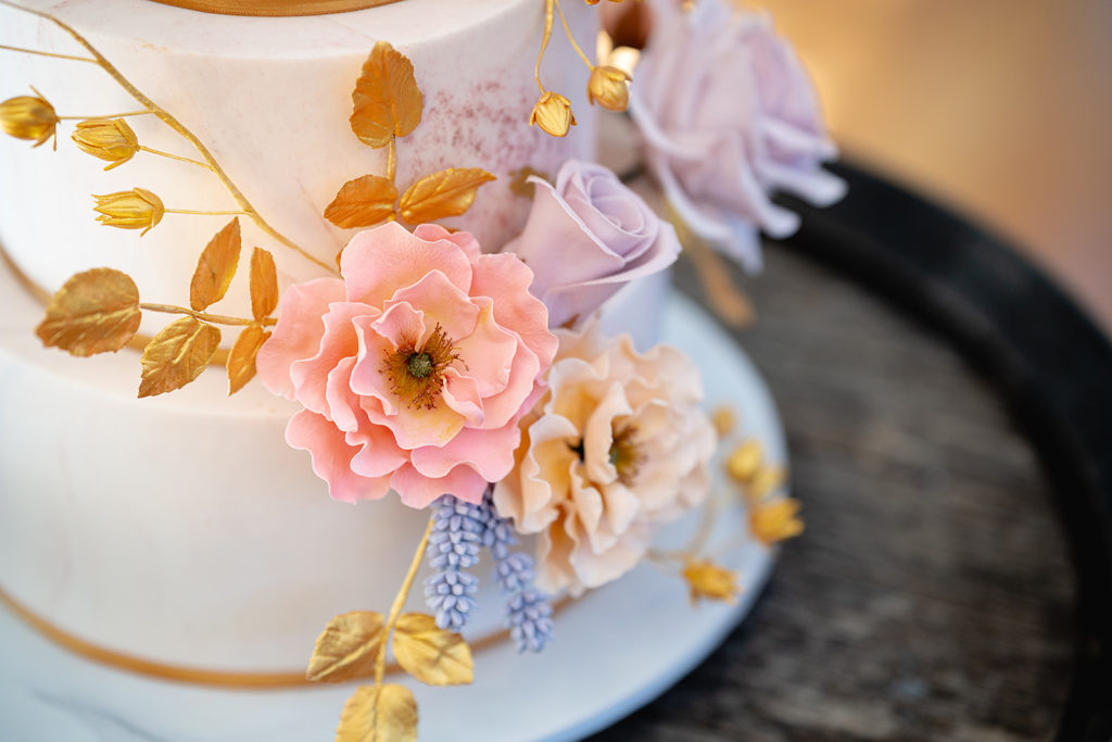 Detail image of the edible flowers on a wedding cake 
